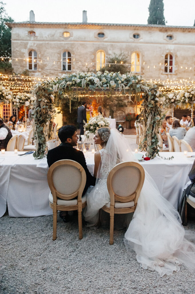the bride and the groom at the top table for their wedding at chateau de robernier 